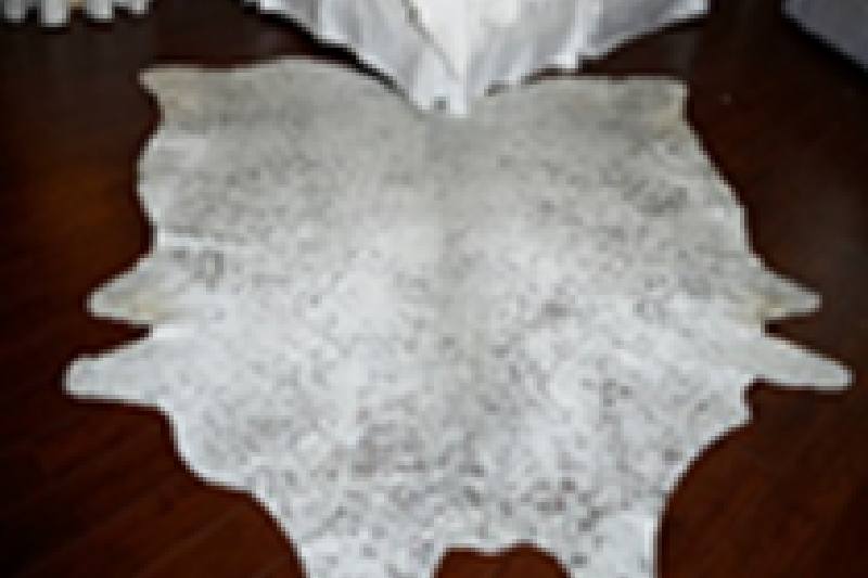 solid white Natural cowhide on a floor