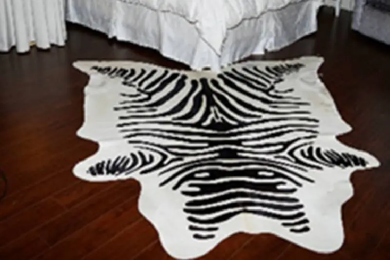 black and white Natural cowhides on the floor