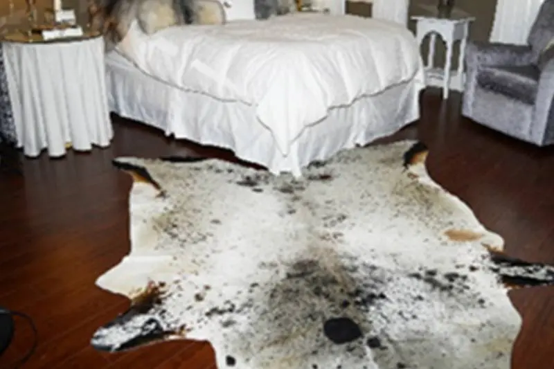 natural cowhide with black spots on it